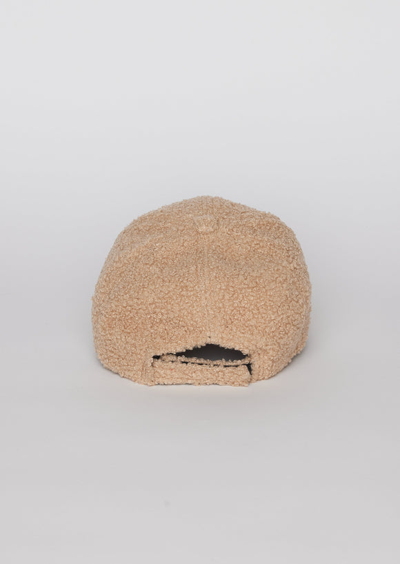 Back of light tan sherpa baseball cap