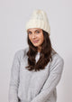 Ivory cable knit cuffed beanie on model