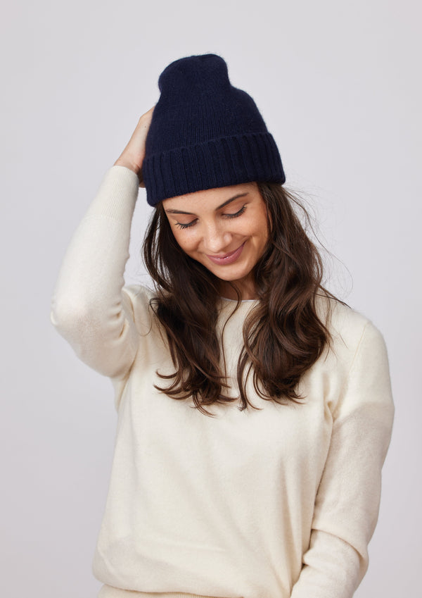 Black cashmere cuff beanie on model