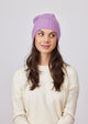 Lilac cashmere slouchy cuff beanie on model in ivory sweater