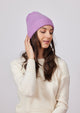 Lilac cashmere slouchy cuff beanie on model looking down to the left