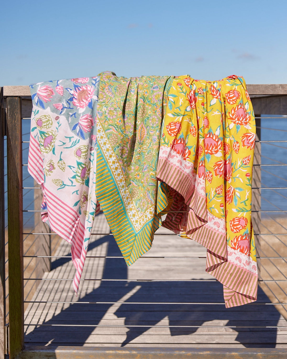 Three cotton printed beach blankets