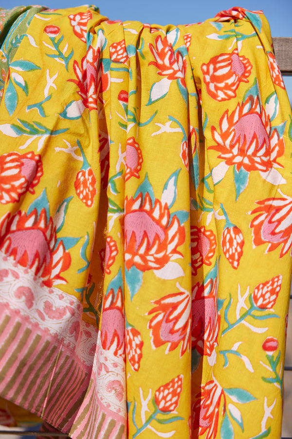 Yellow and red floral beach blanket