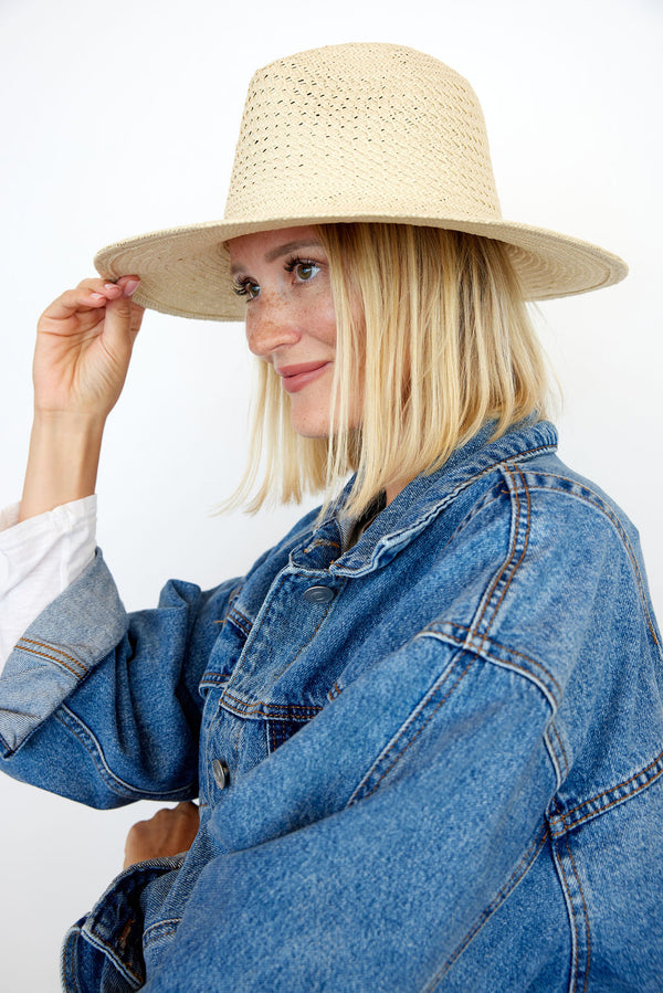 Model wearing tan perforated and vented sun hat