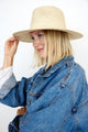 Model wearing tan perforated and vented sun hat