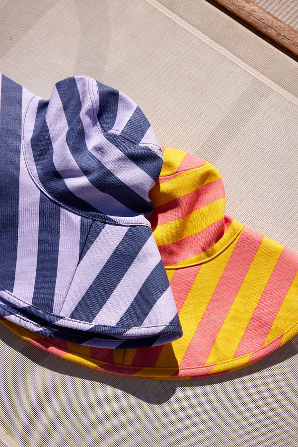 Striped bucket hats on beach chair