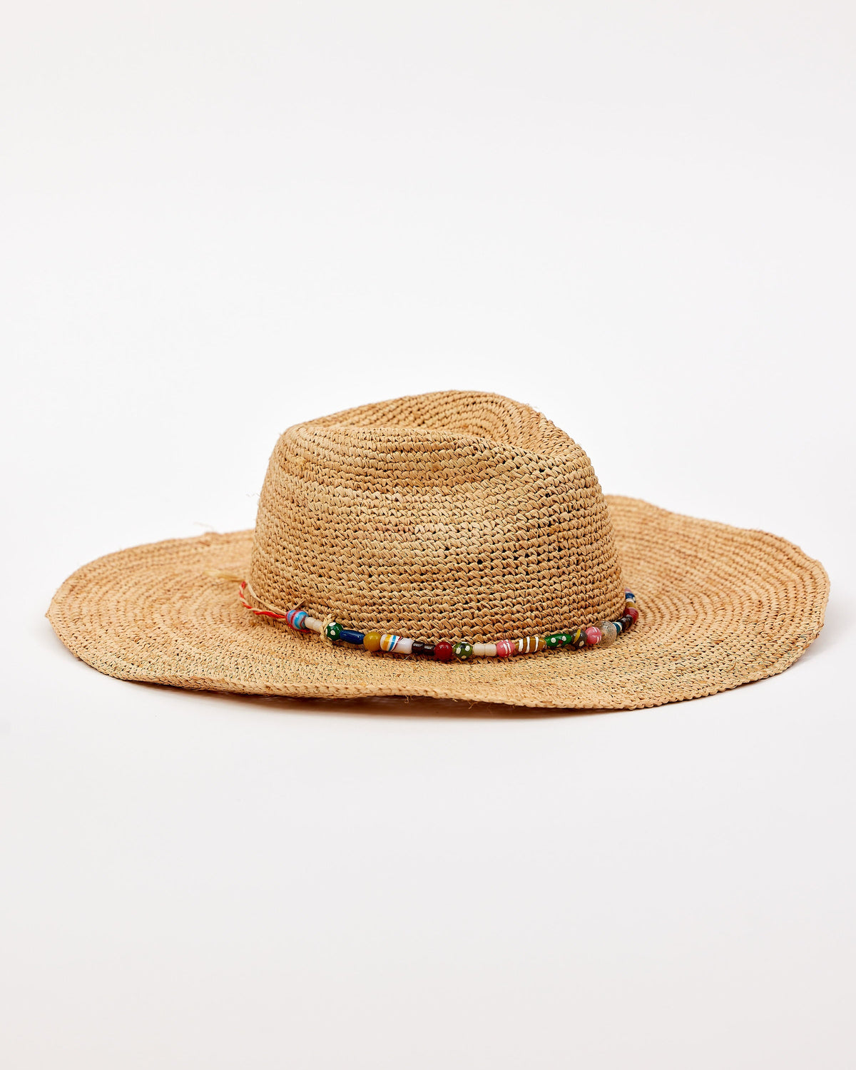 Raffia hat with a beaded band on a white background