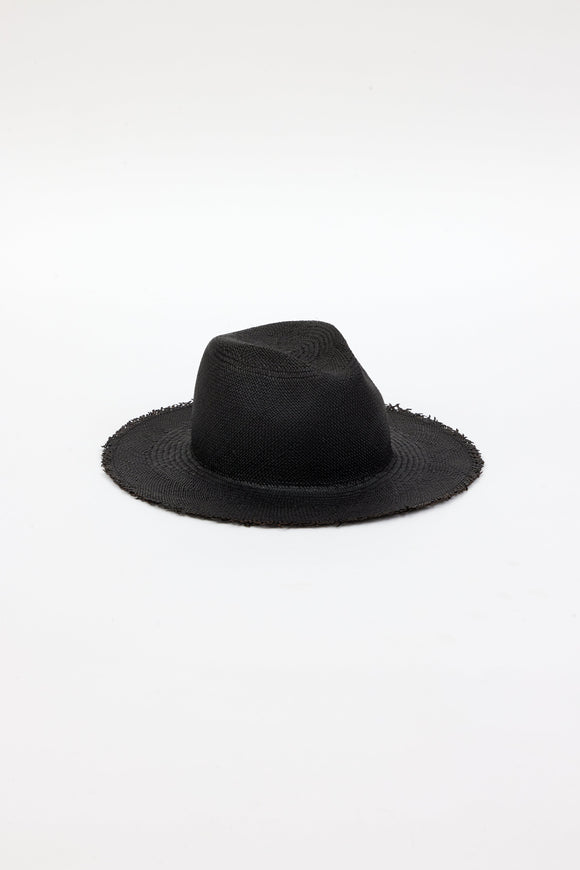 3/4 angle of black straw panama hat with fringe