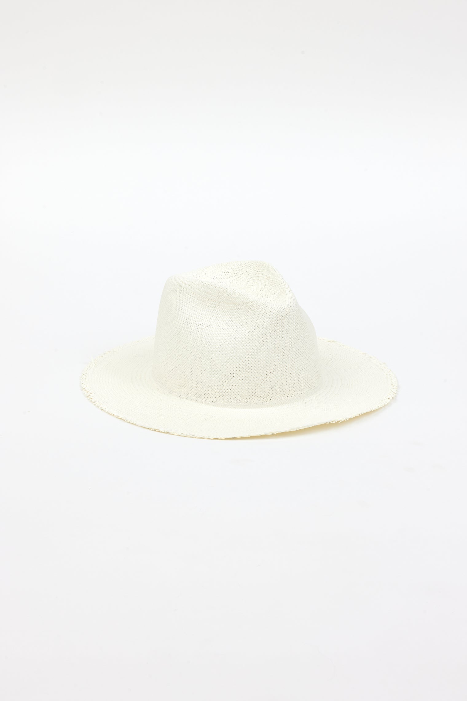 3/4 angle of white fringed panama hat