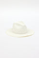 3/4 angle of white fringed panama hat with white trim