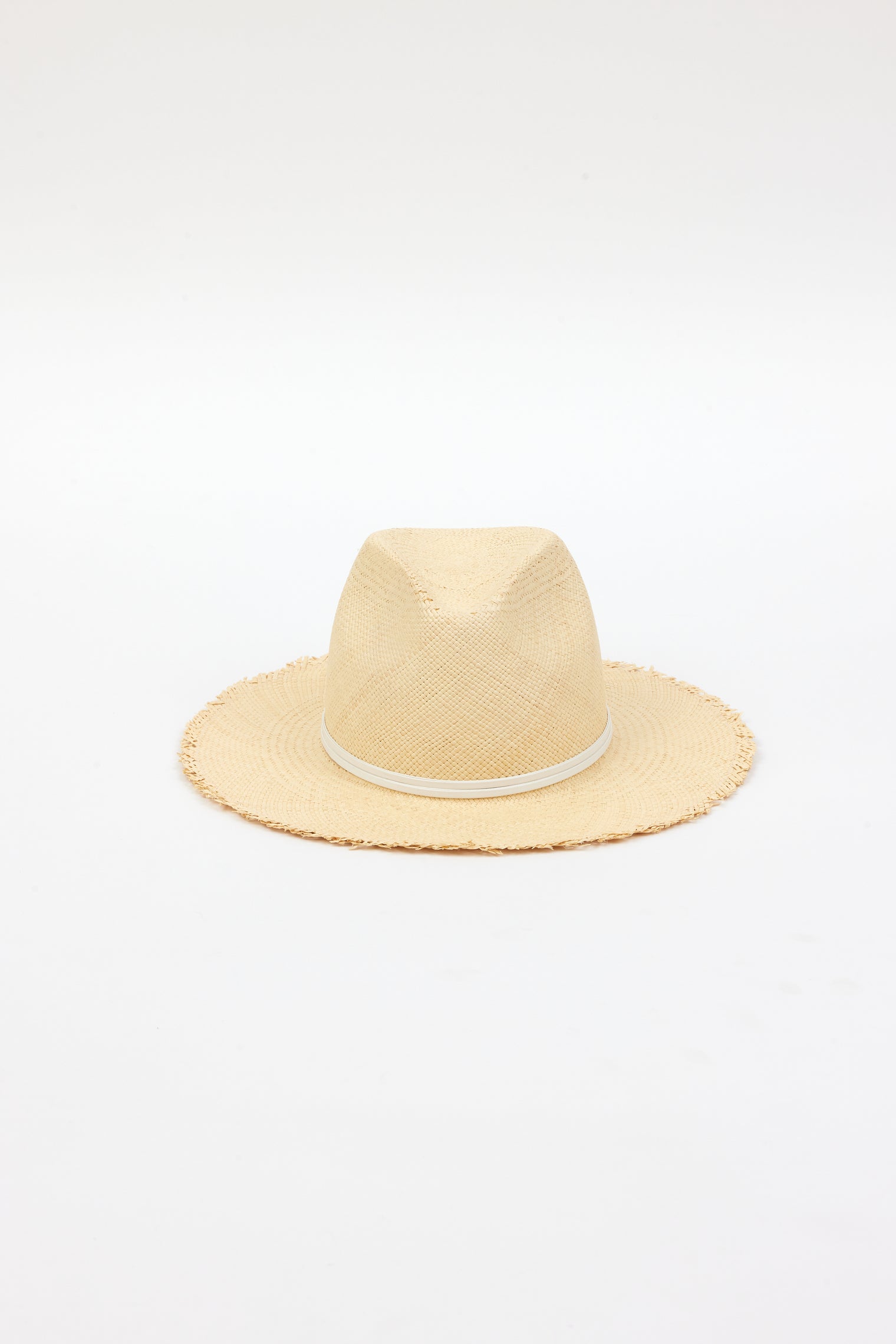 front angle of natural fringed panama hat with white trim