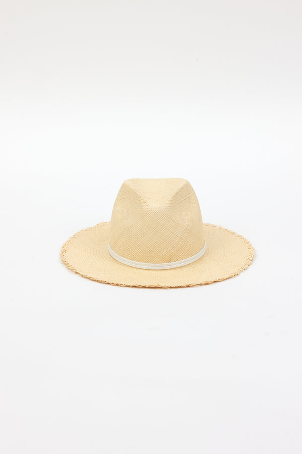 front angle of natural fringed panama hat with white trim