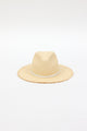 front angle of natural fringed panama hat with white trim