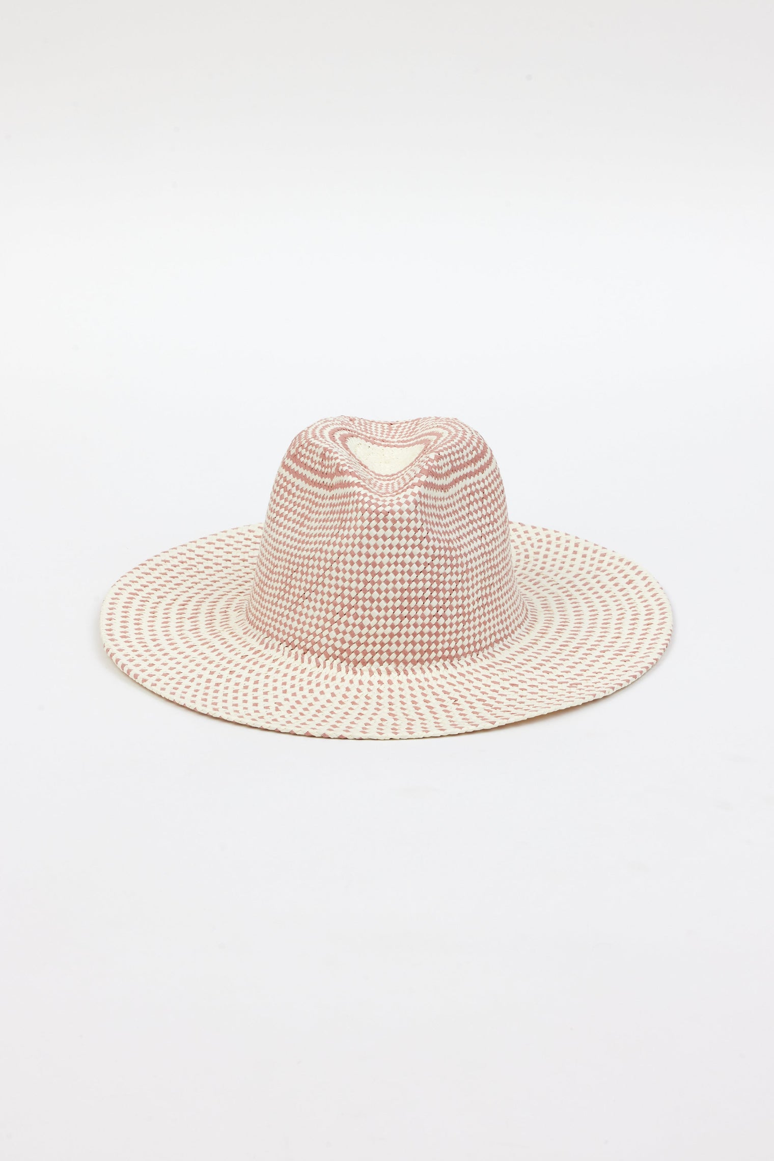 Front angle of pink and natural colored brimmed straw sun hat