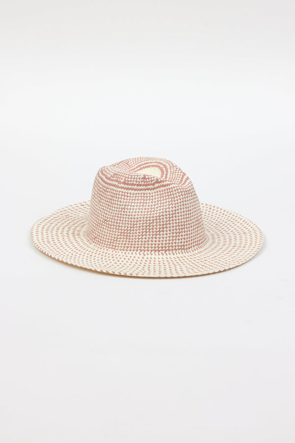 3/4 angle of pink and natural colored brimmed straw sun hat