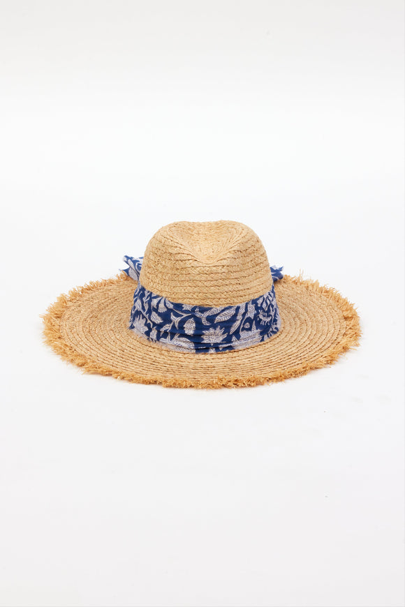 front of braided raffia sunhat with royal blue floral trim