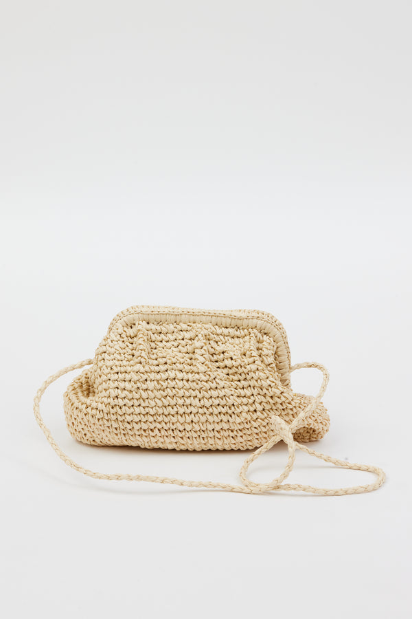light tan straw slouchy bag with crossbody strap