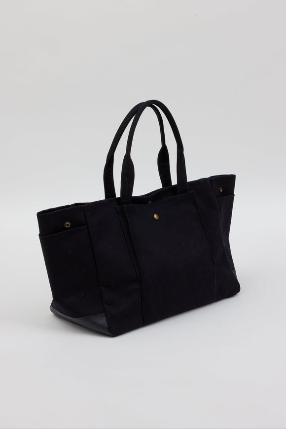 3/4 angle of black tote with pockets
