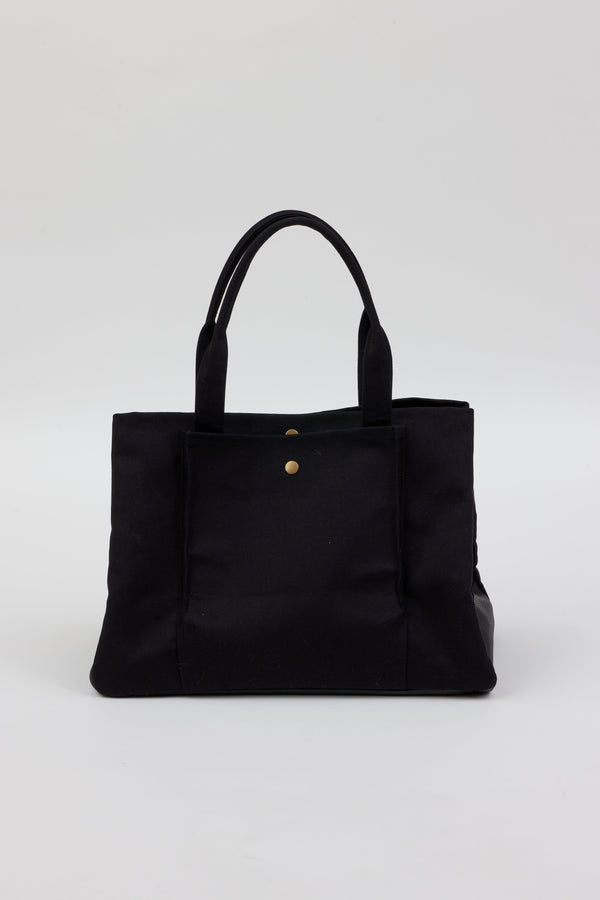 Collapsed black tote with pockets