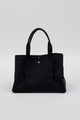 Collapsed black tote with pockets