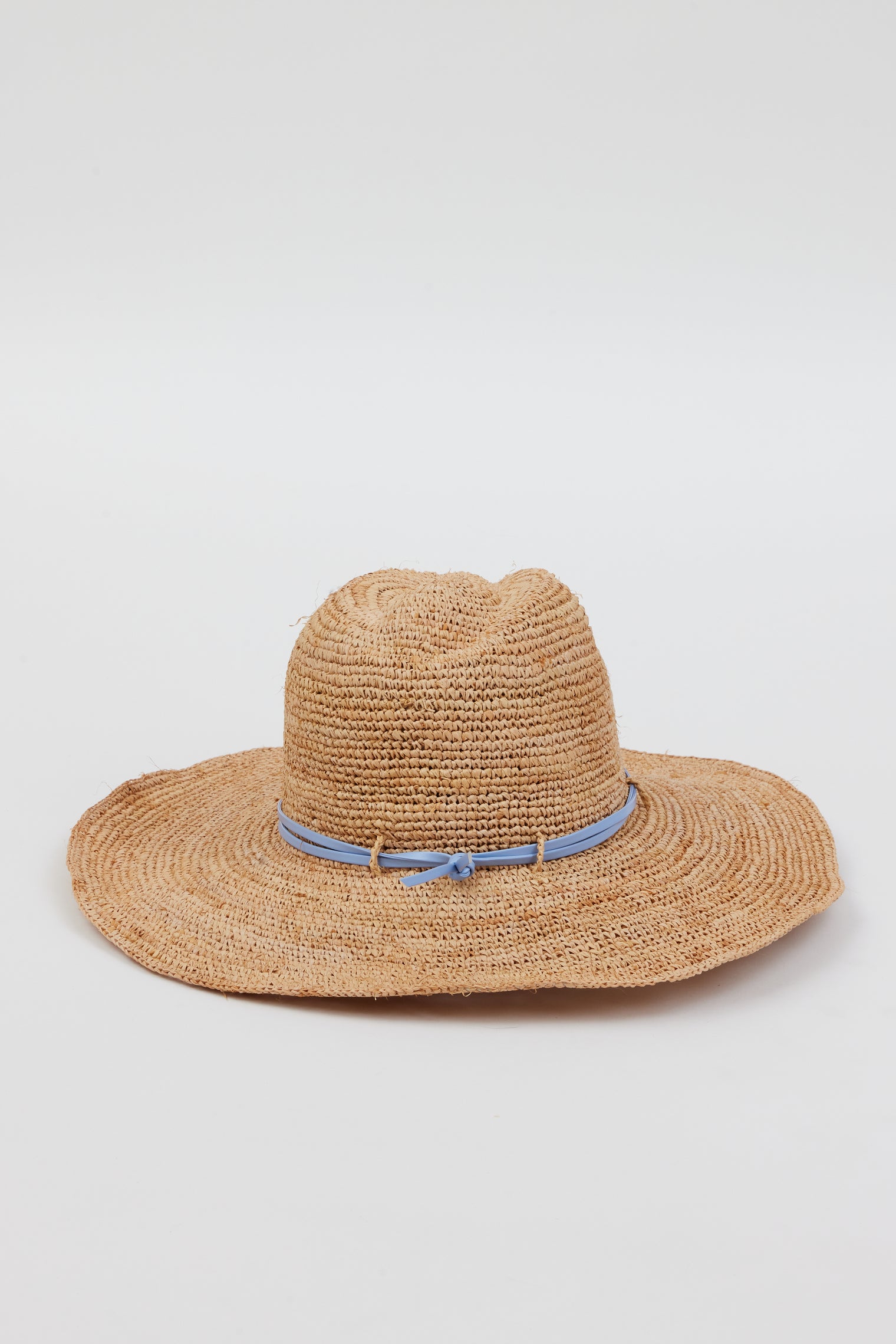 Back of raffia straw sun hat with blue wrap detail
