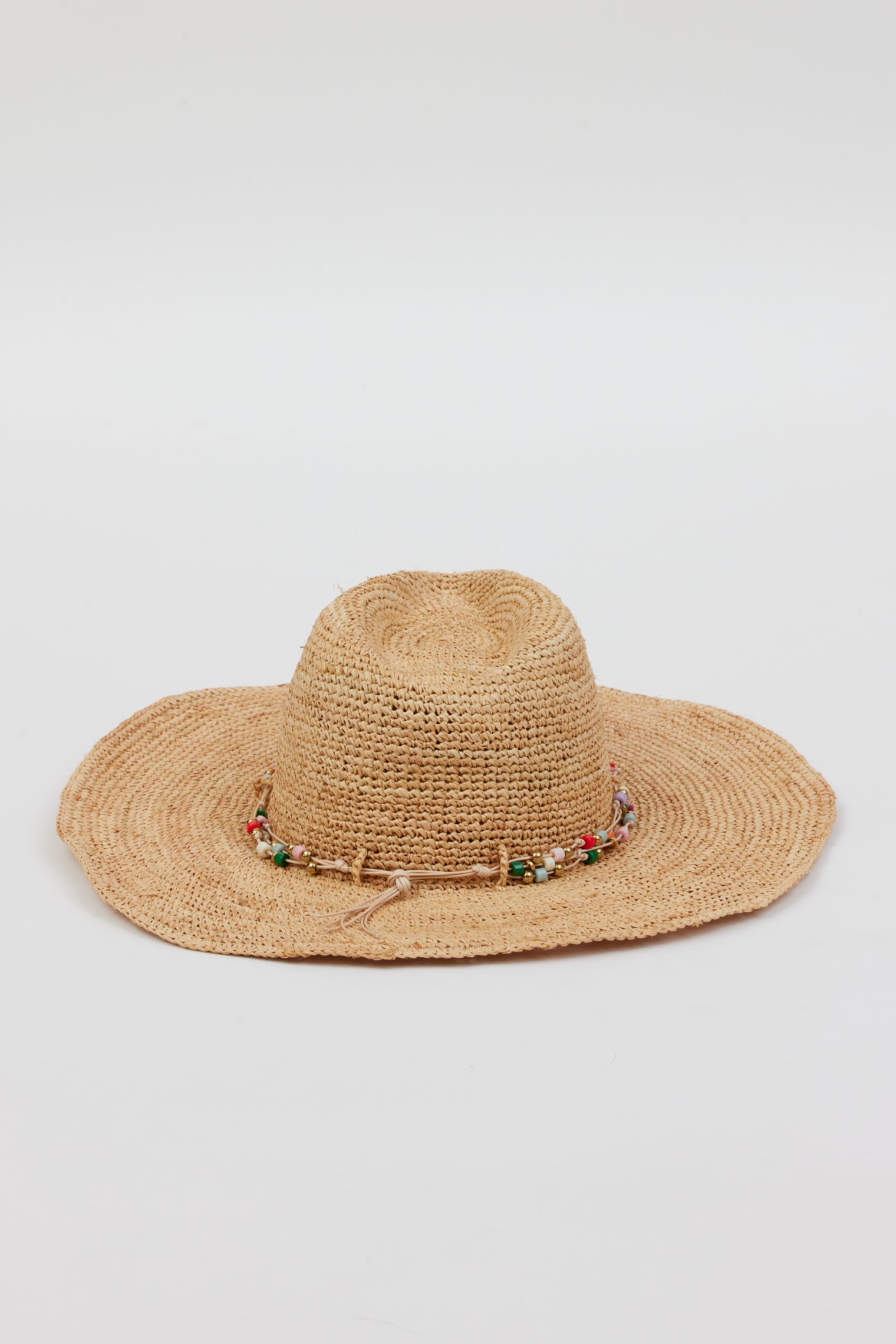 Back of tan straw woven sunhat with multi colored beaded trim
