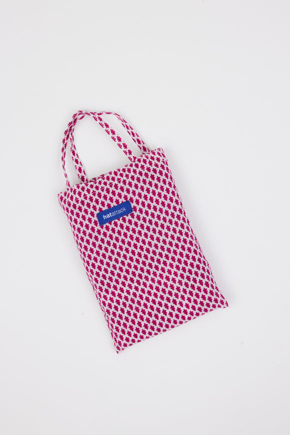 Pink and white sarong bag