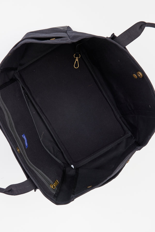 Aerial view of inside of black tote with pockets