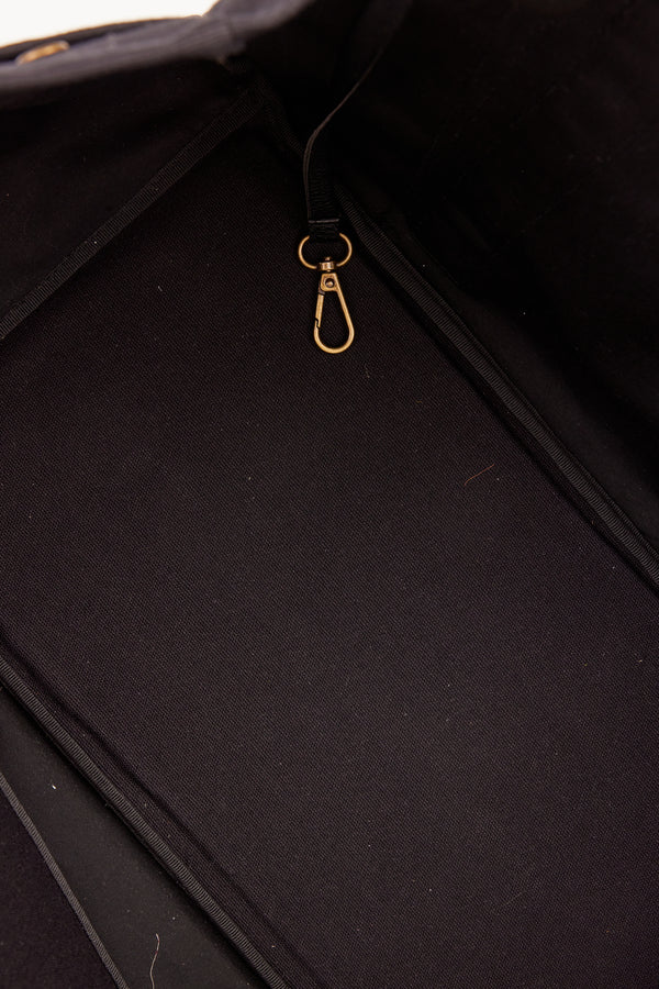 Interior of black tote with pockets