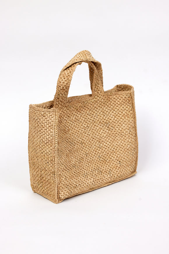 3/4 angle of tan woven straw bag