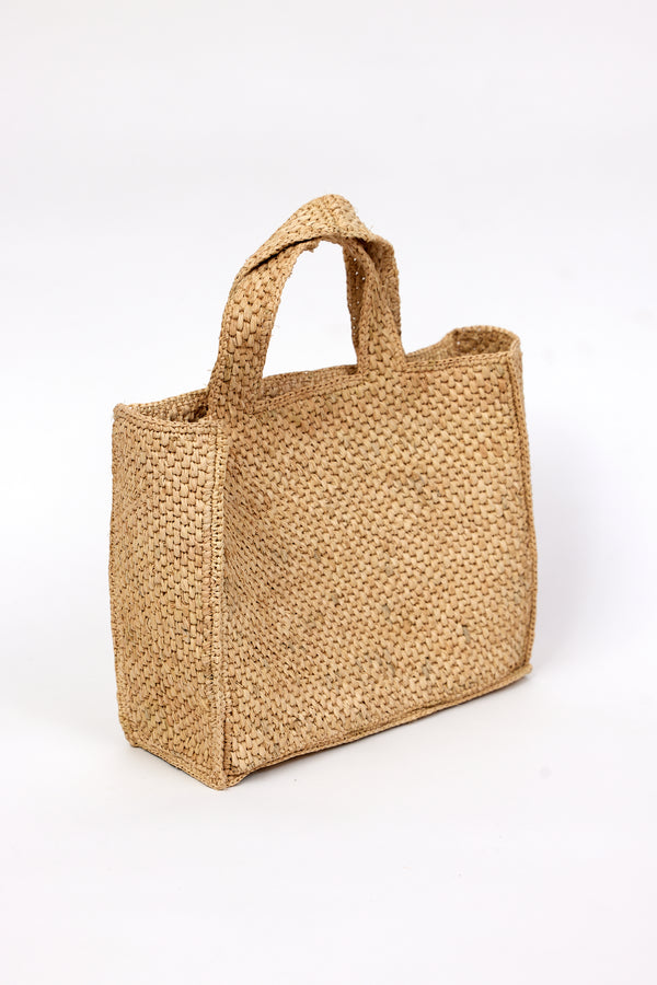 3/4 angle of tan woven straw bag