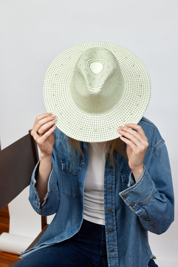 Mint and natural colored brimmed straw sun hat on model