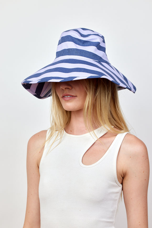 Model wearing blue and lavender bucket hat
