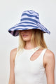 Model wearing blue and lavender bucket hat