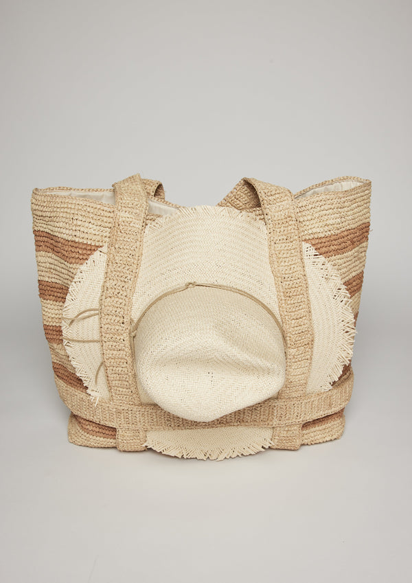 Tan striped straw tote with a sun hat attached