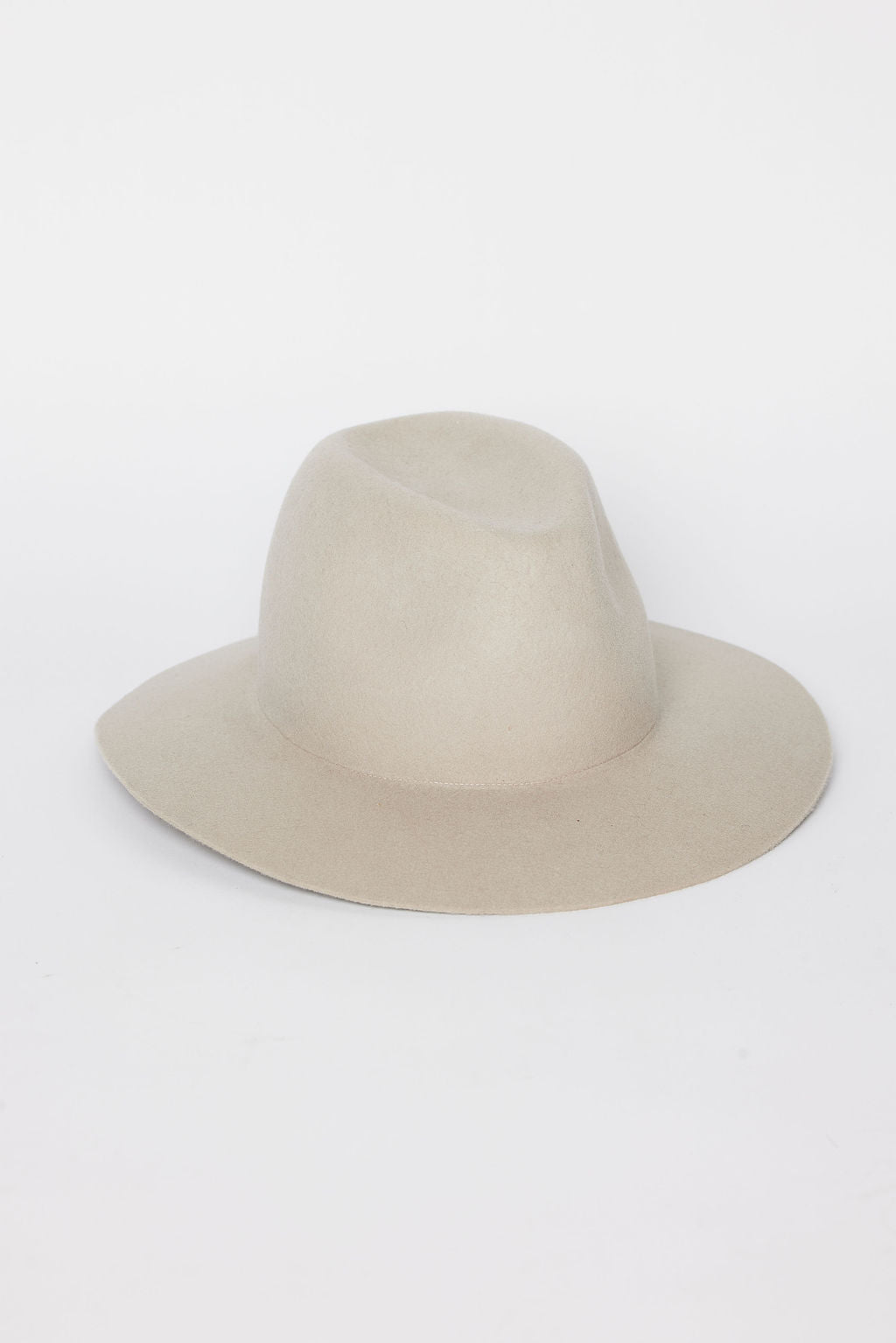 Beige fedora hat on a white background