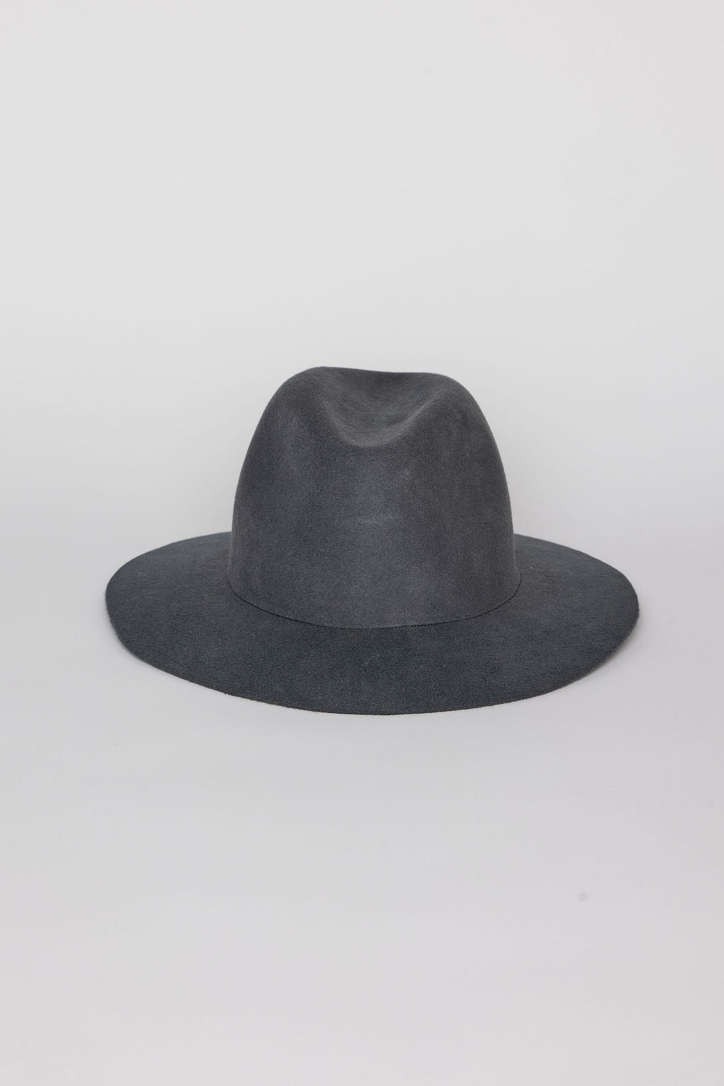 Front of gray fedora hat on a light gray background