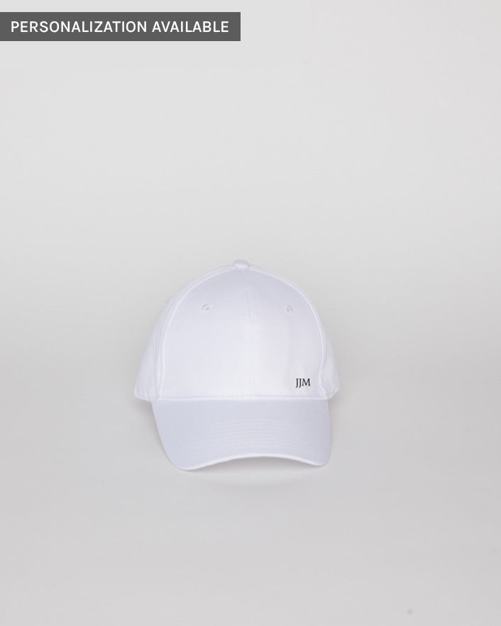White baseball hat with embroidered letters