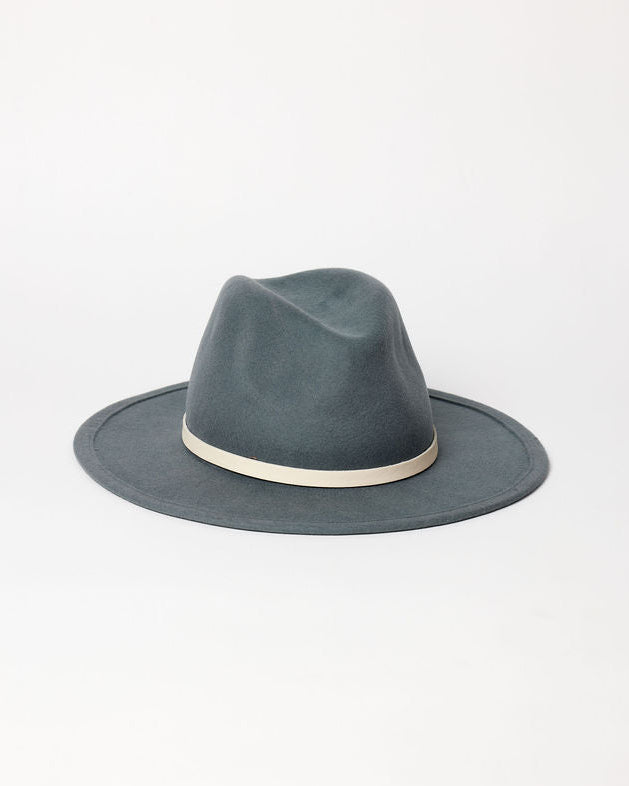 Blue fedora hat with a white band on a light gray background