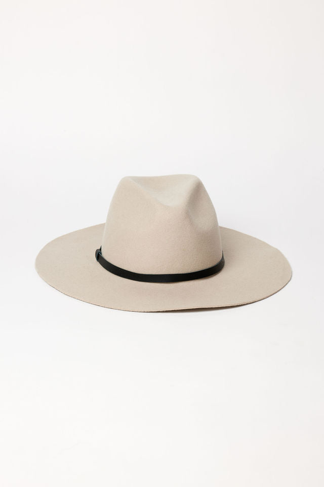 Beige fedora hat with a black band on a white background