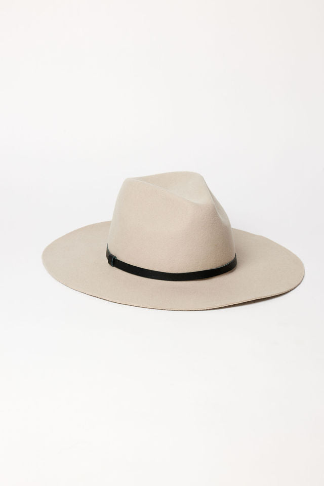 Beige hat with a black band on a white background