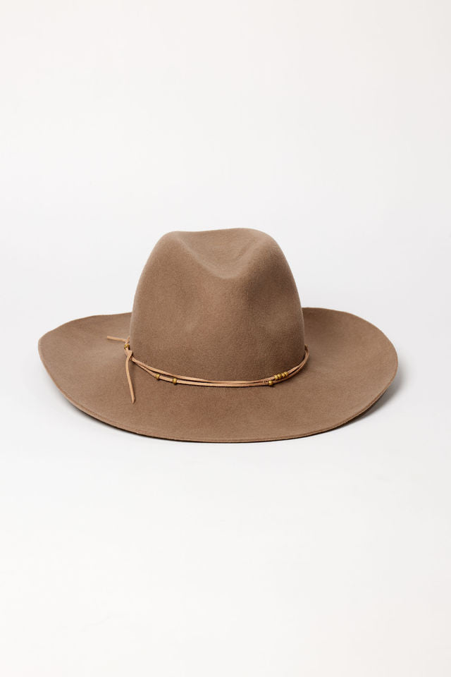 Brown felt fedora hat with a decorative band on a white background