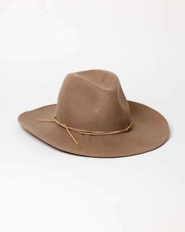 Brown felt cowboy hat with a band on a white background