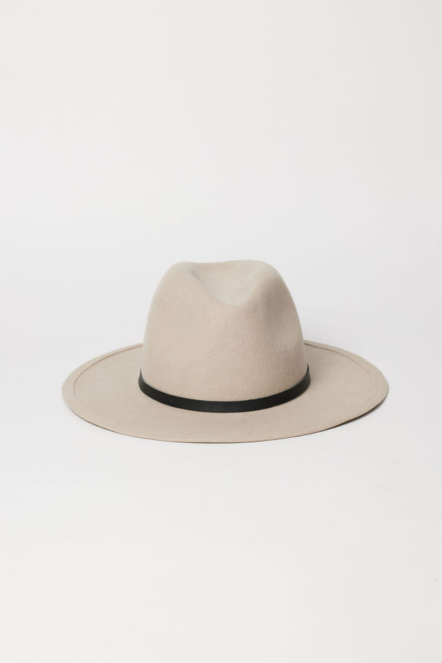Beige fedora hat with a black band on a white background