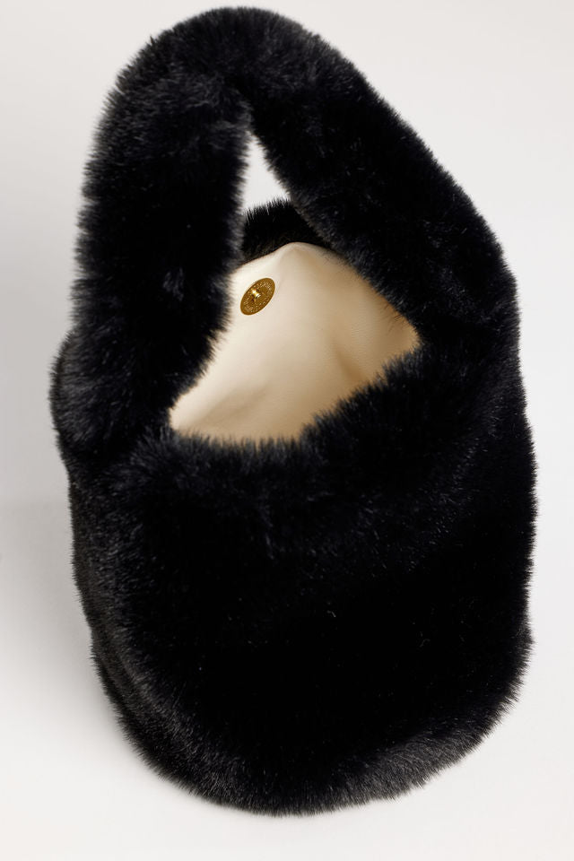 Inside of black faux fur mini bag