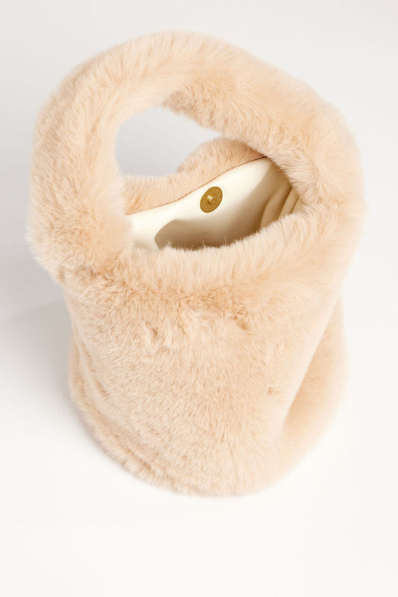 Inside of tan faux fur mini bag