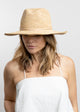Model wearing crochet sunhat with tan wrap