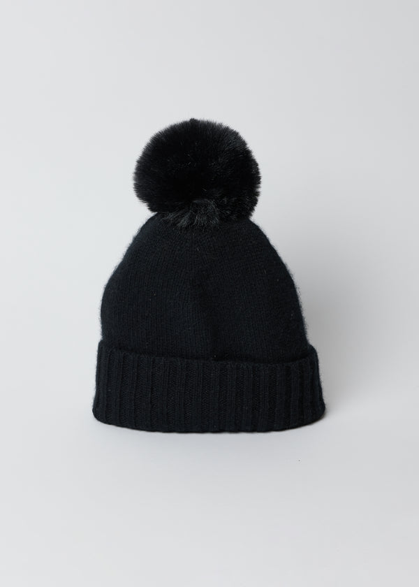 Black cashmere cuffed beanie with faux fur pom