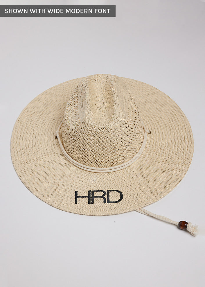 Surfer style sun hat with black embroidered letters