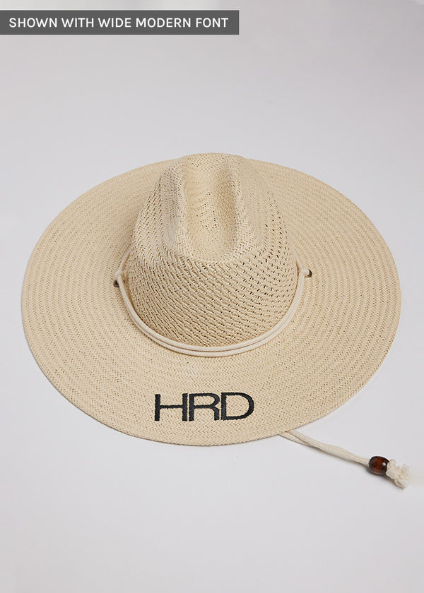 Surfer style sun hat with black embroidered letters